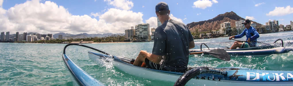 Jimmy Austin and Johnnie Puakea paddle Ehukai OC1 canoes as they prepare for the Kaiwi Channel OC1 Championship